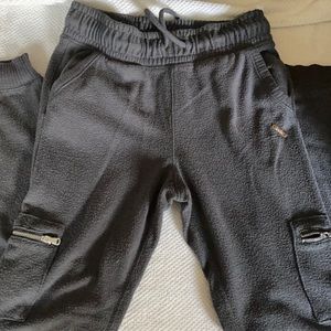 Grey joggers with silver zipper detail